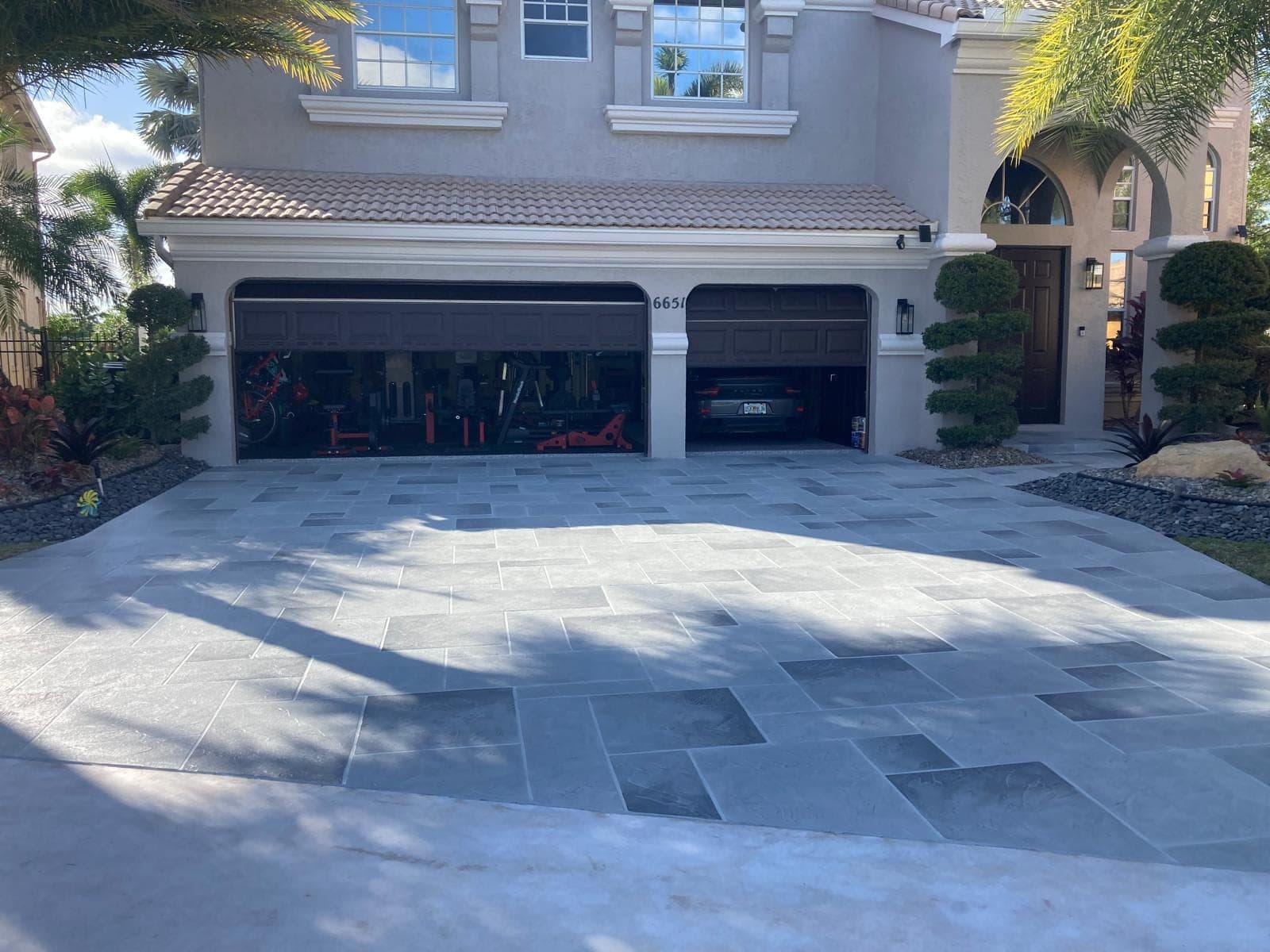 Grey tile overlay mansion driveway