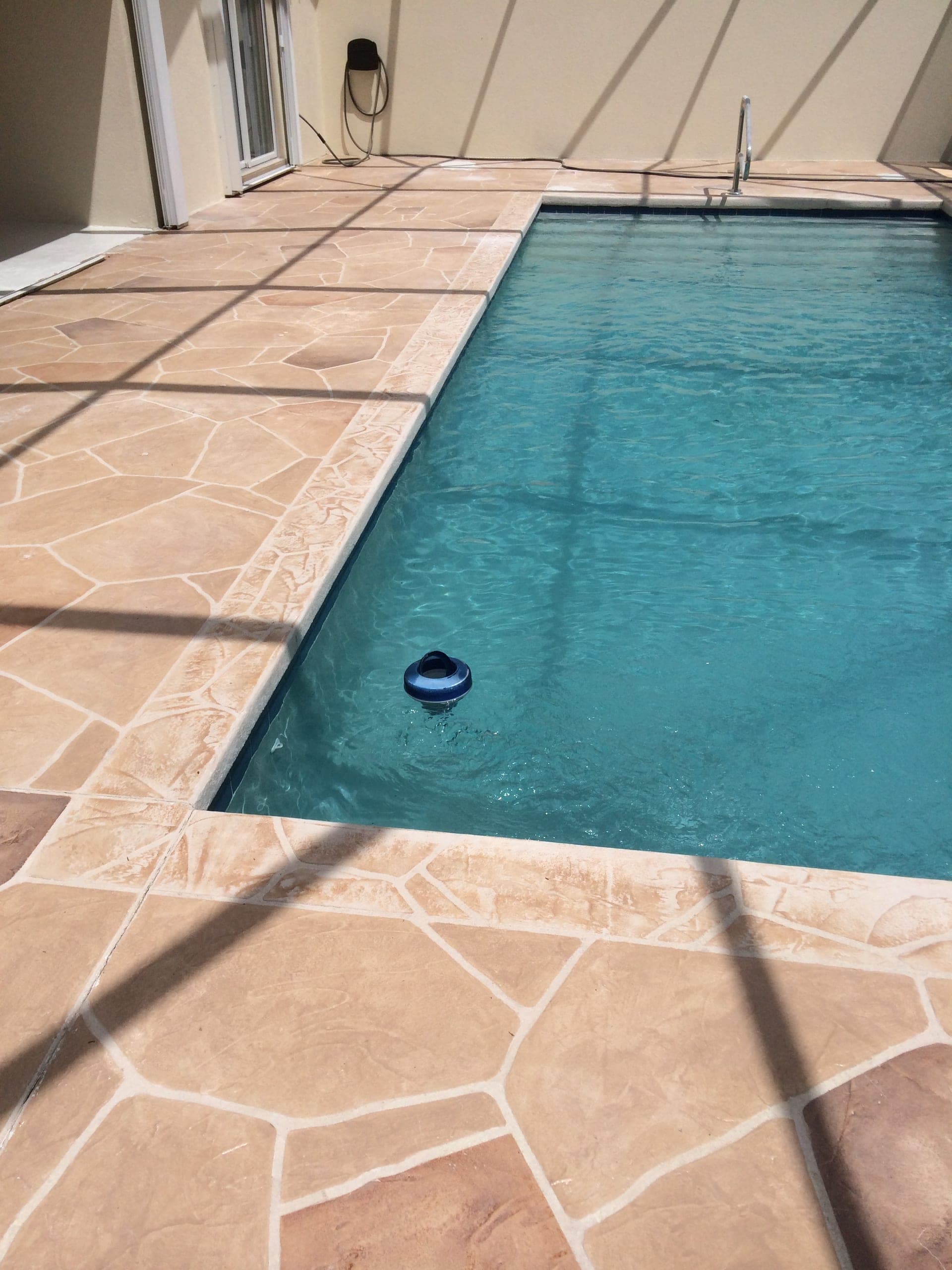 Tan flagstone rectangular pool
