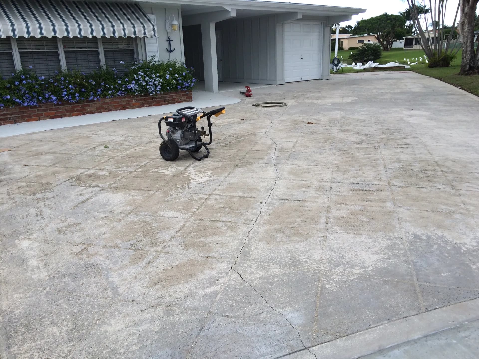 Cracked concrete surface in South Florida before professional repair