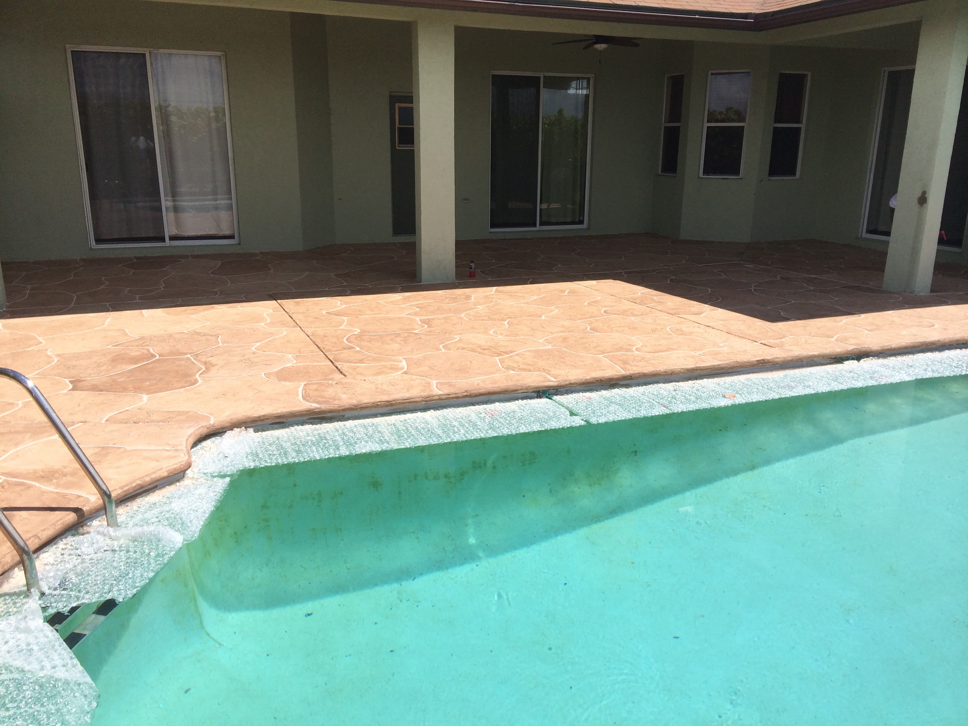 Pool and patio with tan flagstone